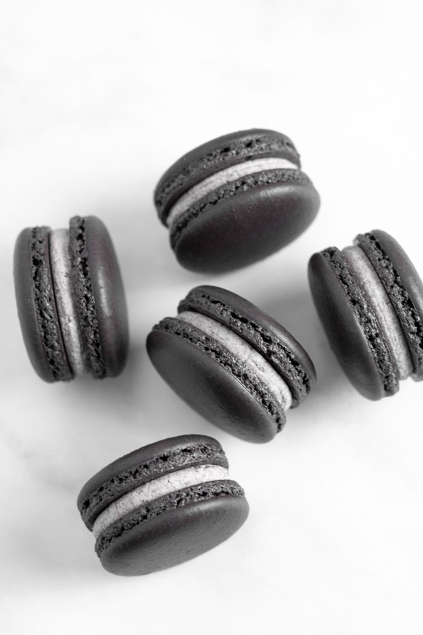 black macarons with cookies and cream filling