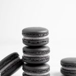 stack of black macarons