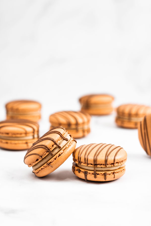 chocolate strawberry macarons with chocolate drizzle