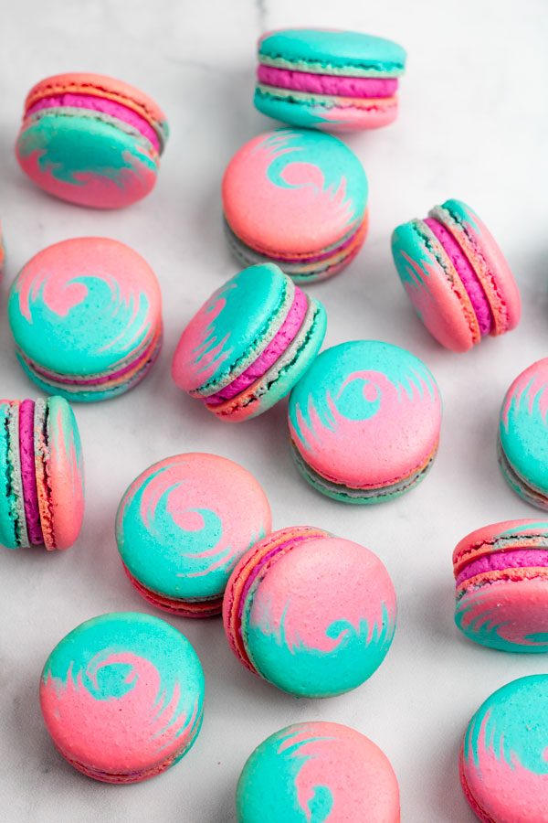 blue and pink cotton candy macarons with pink buttercream