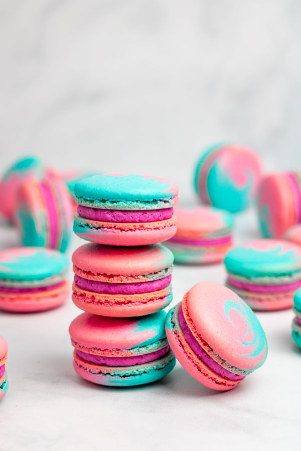 stack of three blue and pink cotton candy macarons