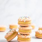 dulce de leche macarons stacked on top of each other
