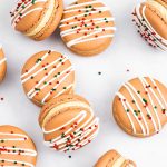 gingerbread macarons with royal icing and sprinkles