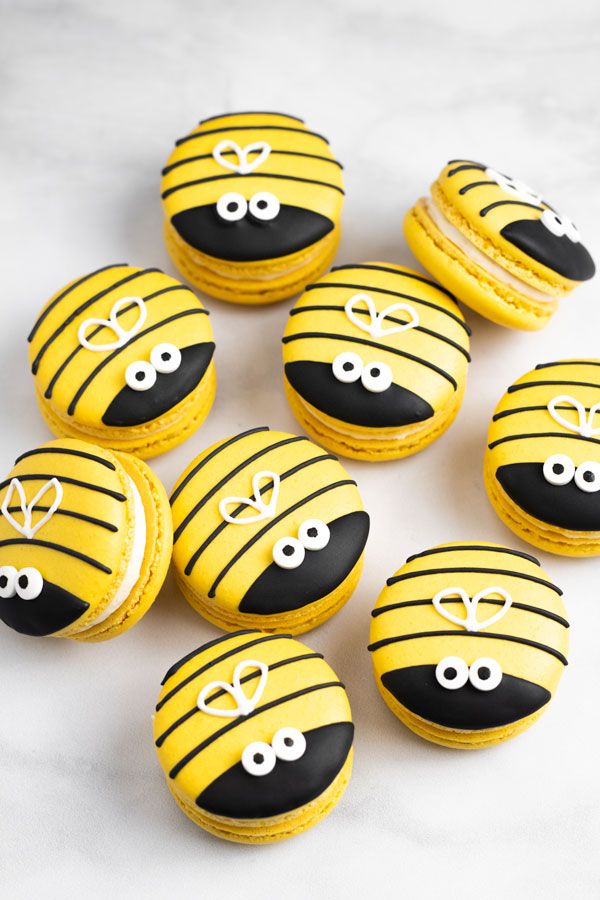 yellow honey macarons on white background