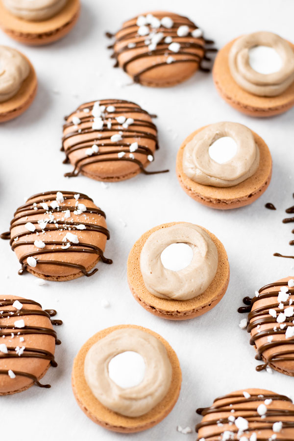 macarons with chocolate buttercream and marshamallow filling drizzled with chocolate and mini marshamallow bits