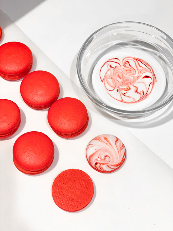 candy cane macarons decorated with royal icing