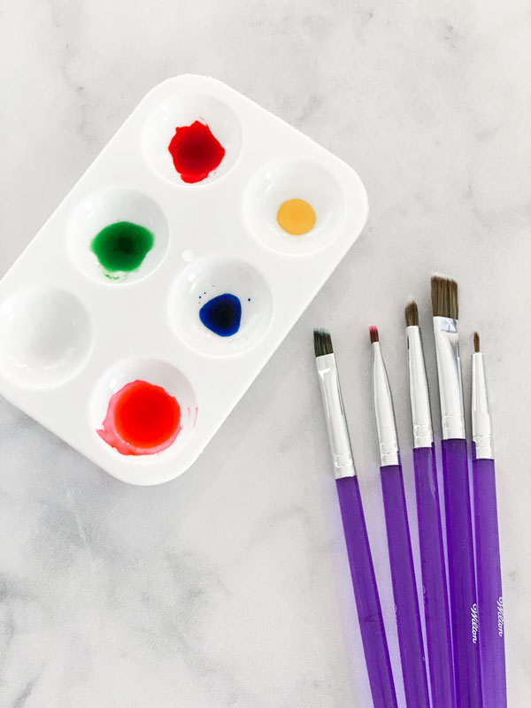 paint palette with food coloring and brushes