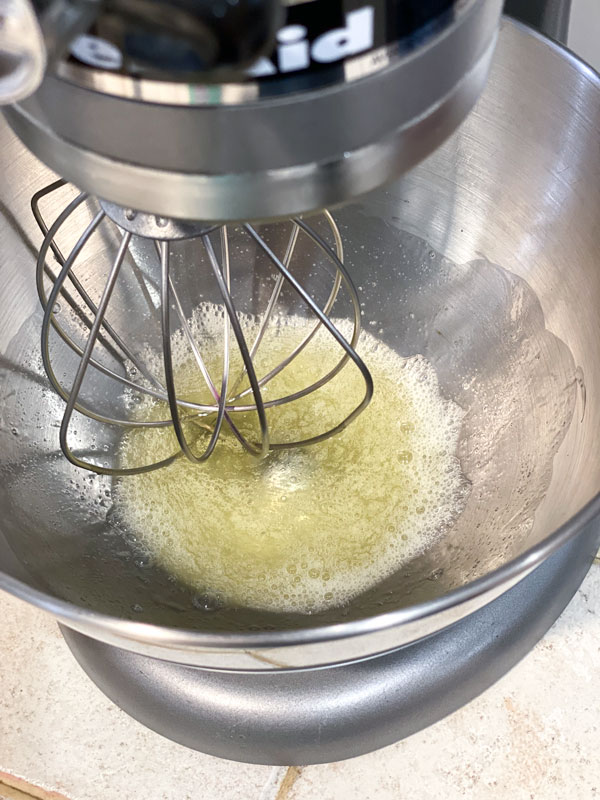 egg whites in mixing bowl with whisk