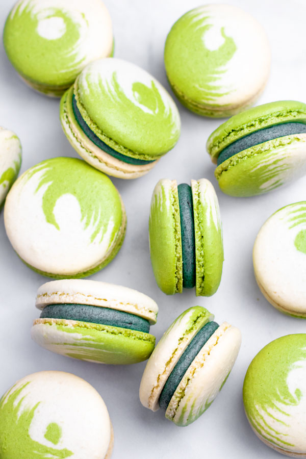 green and white swirled matcha macarons