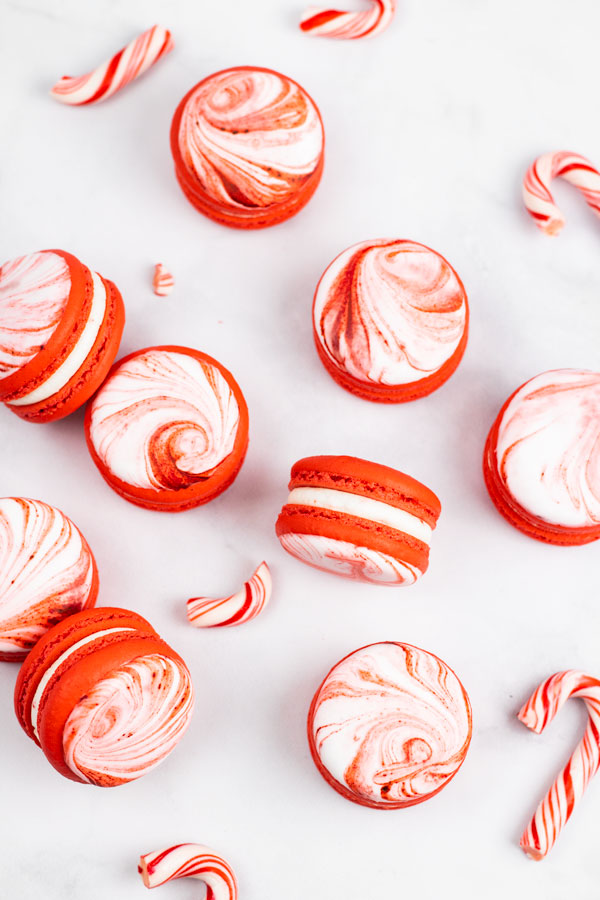 red and white peppermint candy cane macarons