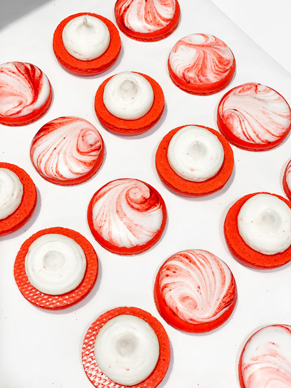 candy cane macaron shells with peppermint buttercream