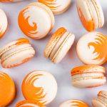 orange and white swirled pumpkin cheesecake macarons
