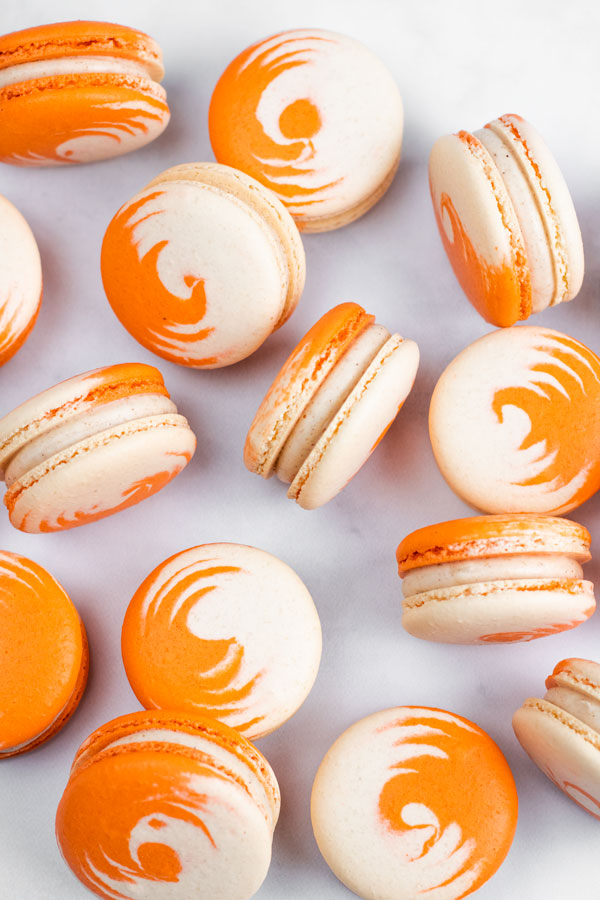 orange and white swirled pumpkin cheesecake macarons