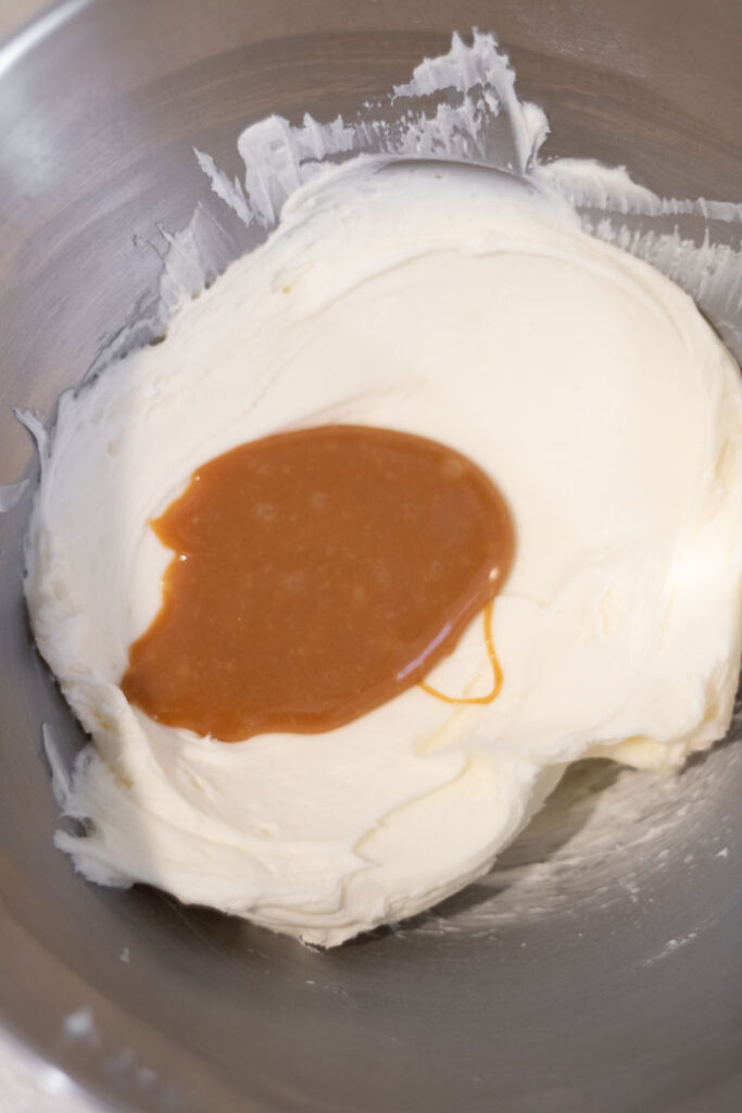 salted caramel sauce and buttercream in mixing bowl