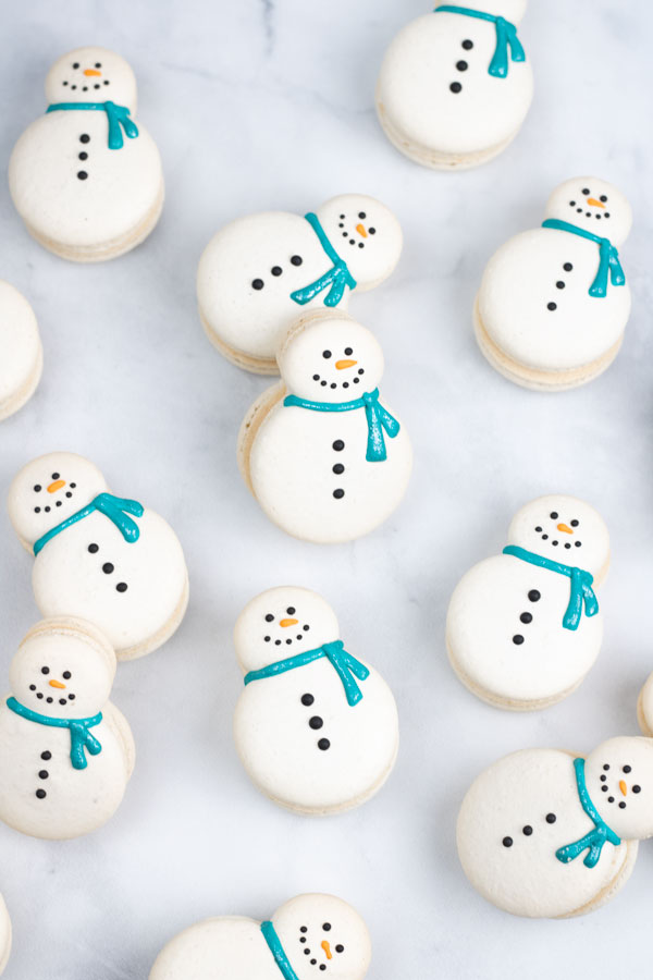 snowman macarons with blue shimmer scarf