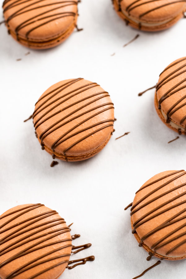 chocolate macarons with chocolate drizzle