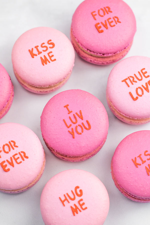 Light and dark pink conversation heart macarons