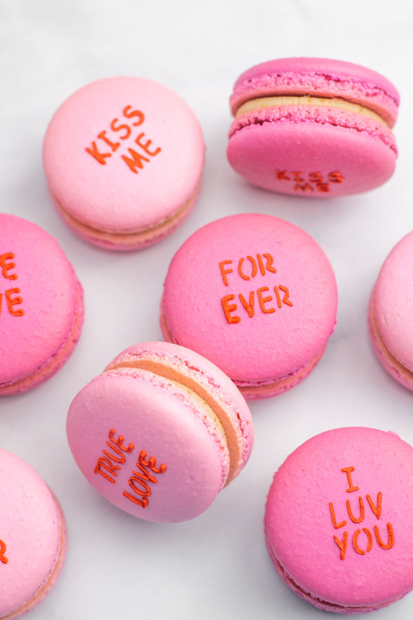 Light pink and dark pink conversation heart macarons